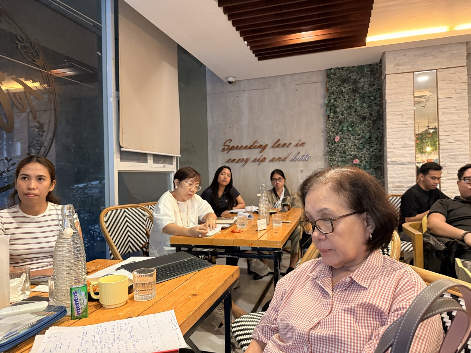 Members listening and taking notes