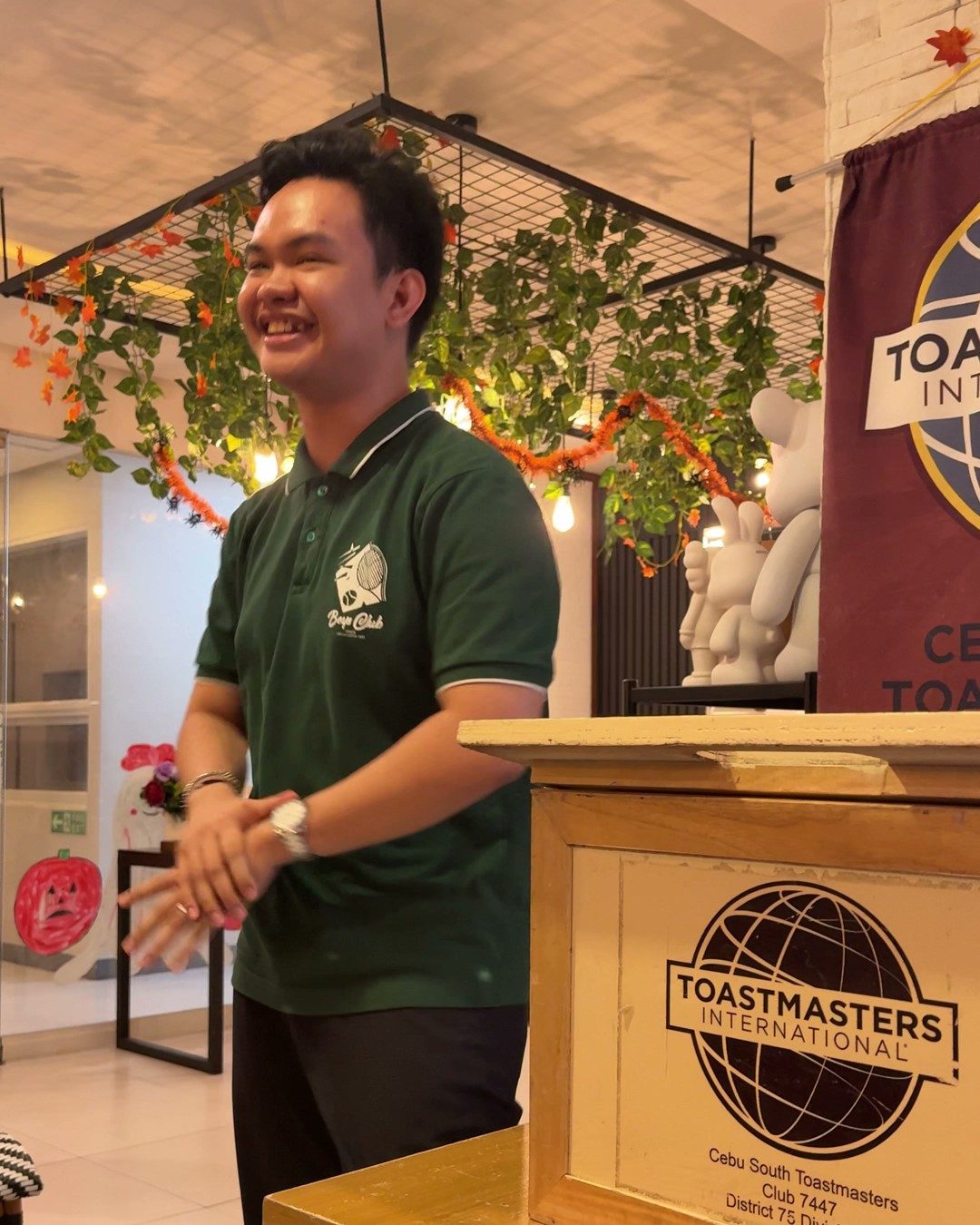 Niño Joseph Sumampong smiling at the lectern